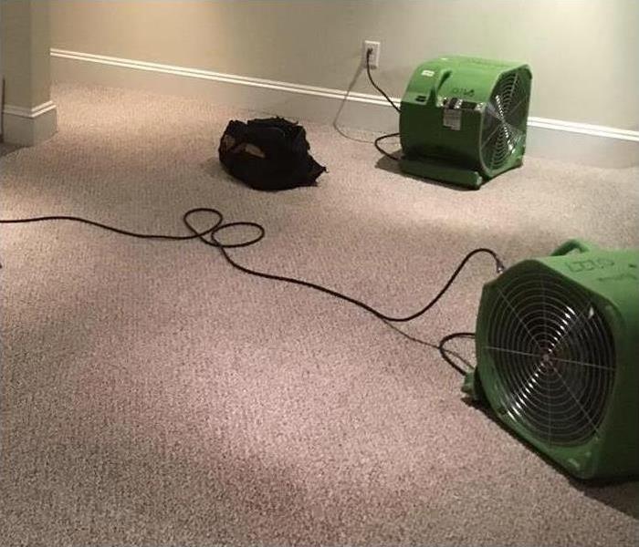 Air movers placed in carpet drying wet area